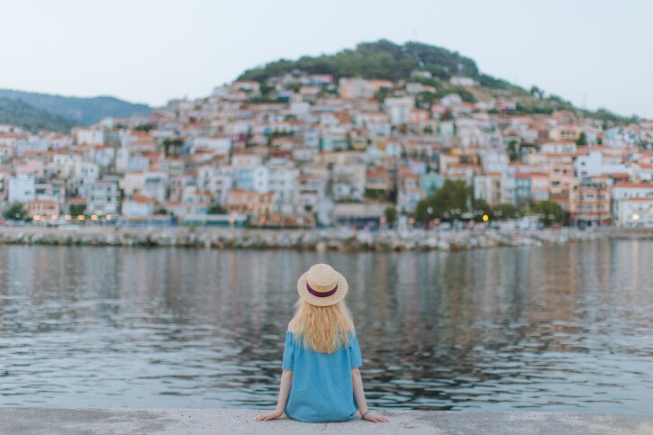 figure_sitting_by_water